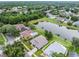Aerial view of lakeside homes featuring screened pools, lush landscaping and beautiful water views at 9246 Dayflower Dr, Tampa, FL 33647