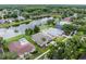 Aerial view of beautiful lakeside homes with manicured lawns, mature landscaping and community amenities at 9246 Dayflower Dr, Tampa, FL 33647