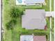 Aerial view showcases the house roof, backyard, landscaping, and proximity to the lake at 9246 Dayflower Dr, Tampa, FL 33647