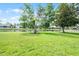 Beautiful backyard featuring mature trees and picturesque pond views, creating a peaceful outdoor space at 9246 Dayflower Dr, Tampa, FL 33647