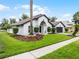 Beautiful one-story home with manicured lawn and lush landscaping, creating inviting curb appeal at 9246 Dayflower Dr, Tampa, FL 33647