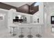 Stylish kitchen with quartz countertops, stainless steel appliances, and a breakfast bar seating area at 9246 Dayflower Dr, Tampa, FL 33647