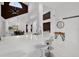 Kitchen with white countertops, modern barstools, and open view into the dining area at 9246 Dayflower Dr, Tampa, FL 33647