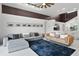 Open-concept living room featuring contemporary decor, comfortable seating and plenty of natural light at 9246 Dayflower Dr, Tampa, FL 33647