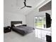 Bedroom featuring sliding glass doors to the backyard at 9246 Dayflower Dr, Tampa, FL 33647