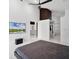 Main bedroom featuring ensuite bath, walk-in closet, and high ceilings at 9246 Dayflower Dr, Tampa, FL 33647