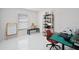 Home office with bright natural light, modern desk, and shelving, providing a functional workspace at 9246 Dayflower Dr, Tampa, FL 33647