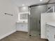 Bathroom features dual vanity sinks, a lighted mirror, and a glass shower enclosure at 9573 Migue Cir, Port Charlotte, FL 33981