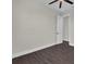 This bedroom boasts wood-look tile, a door to the hallway, and fresh paint at 9573 Migue Cir, Port Charlotte, FL 33981