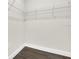 Walk-in closet with white wire shelving and wood look flooring at 9573 Migue Cir, Port Charlotte, FL 33981
