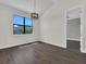 Dining area with pendant lighting and wood look flooring at 9573 Migue Cir, Port Charlotte, FL 33981