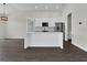 Bright, white kitchen with island, stainless steel appliances, and an open layout at 9573 Migue Cir, Port Charlotte, FL 33981