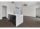 Kitchen island with white quartz countertop with a dishwasher at 9573 Migue Cir, Port Charlotte, FL 33981