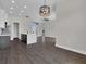 Bright kitchen features an island with dark cabinets and modern lighting fixture at 9573 Migue Cir, Port Charlotte, FL 33981