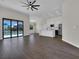 Spacious living room featuring an open floor plan and large glass doors to the outdoor pool at 9573 Migue Cir, Port Charlotte, FL 33981
