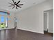 Bright living space with French doors leading to the backyard and modern flooring at 9573 Migue Cir, Port Charlotte, FL 33981