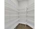 Pantry features white wire shelving and wood look flooring at 9573 Migue Cir, Port Charlotte, FL 33981