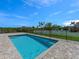 Inviting backyard pool with a brick paver deck and secure metal fencing at 9573 Migue Cir, Port Charlotte, FL 33981