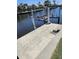 A boat dock equipped with a lift provides access to the tranquil waters, making it perfect for boating enthusiasts at 134 Gulfview Rd, Punta Gorda, FL 33950