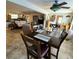 Open-concept dining area with tile floors and seamless transition to living room and kitchen at 134 Gulfview Rd, Punta Gorda, FL 33950