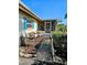 Exterior side view of property featuring a screened in porch, seating area, and rock landscaping at 134 Gulfview Rd, Punta Gorda, FL 33950