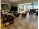 Spacious living room featuring tile flooring, comfortable seating, and an open floor plan to the dining area at 134 Gulfview Rd, Punta Gorda, FL 33950