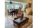 Inviting living area with comfortable seating, tile floors, and view into dining area at 134 Gulfview Rd, Punta Gorda, FL 33950