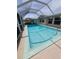 Screened-in pool and deck area, perfect for outdoor relaxation and entertaining with view of home at 134 Gulfview Rd, Punta Gorda, FL 33950