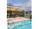 Inviting screened-in pool area with outdoor seating and serene views of waterway at 134 Gulfview Rd, Punta Gorda, FL 33950