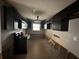 Kitchen with modern appliances and dark cabinetry offers great potential at 1801 Hibiscus S Ct, Oldsmar, FL 34677
