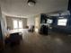 An open floor plan showcases a spacious kitchen and living area, full of potential at 1801 Hibiscus S Ct, Oldsmar, FL 34677