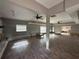 Spacious living room with hardwood floors, ceiling fans, and ample natural light at 1801 Hibiscus S Ct, Oldsmar, FL 34677