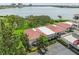 Aerial shot capturing the building's architecture, water view, parking, green spaces and waterfront location at 6218 Palma Del Mar S Blvd # 103, St Petersburg, FL 33715