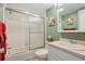 Charming bathroom with shower-tub, vanity with storage, and decorative accents at 6218 Palma Del Mar S Blvd # 103, St Petersburg, FL 33715