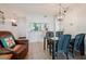 Inviting dining area with seating for four, a stylish light fixture, and pass-through to the kitchen at 6218 Palma Del Mar S Blvd # 103, St Petersburg, FL 33715