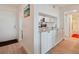 Well-appointed kitchenette with granite countertops, white cabinets, and stainless-steel microwave at 6218 Palma Del Mar S Blvd # 103, St Petersburg, FL 33715