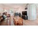 Comfortable living room with a pass-through to the dining area and a relaxing leather sofa at 6218 Palma Del Mar S Blvd # 103, St Petersburg, FL 33715