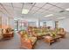 Common area features comfortable wicker seating and view of outdoor patio at 6218 Palma Del Mar S Blvd # 103, St Petersburg, FL 33715