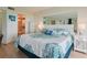 Comfortable main bedroom with large bed and nightstands and access to an attached bathroom at 6218 Palma Del Mar S Blvd # 103, St Petersburg, FL 33715