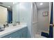 Bathroom featuring modern vanity, decorative mirror, and updated fixtures at 4239 Brentwood Park Cir, Tampa, FL 33624