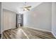 Spacious bedroom with new laminate flooring, ceiling fan, and natural light at 4239 Brentwood Park Cir, Tampa, FL 33624