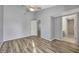 Bedroom with modern ceiling fan, new floors, and ensuite bathroom access at 4239 Brentwood Park Cir, Tampa, FL 33624