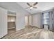This bedroom has new flooring, a ceiling fan, and access to an ensuite bathroom at 4239 Brentwood Park Cir, Tampa, FL 33624