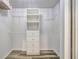 Walk-in closet features custom shelving and closet rod for optimal storage solutions at 4239 Brentwood Park Cir, Tampa, FL 33624