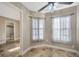 Light-filled flex room with tile floors, neutral walls, sheer window curtains, and ceiling fan at 4239 Brentwood Park Cir, Tampa, FL 33624