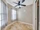Cozy flex room with tile flooring, neutral paint, sheer window treatments, and ceiling fan at 4239 Brentwood Park Cir, Tampa, FL 33624