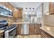 Updated kitchen featuring stainless steel appliances and granite countertops at 4239 Brentwood Park Cir, Tampa, FL 33624