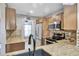 Kitchen featuring stainless steel appliances, granite countertops, and wooden cabinets at 4239 Brentwood Park Cir, Tampa, FL 33624
