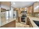 Kitchen with stainless appliances, tiled backsplash, and granite counters at 4239 Brentwood Park Cir, Tampa, FL 33624