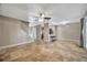 Living room with bar seating, tan tiling, and staircase at 4239 Brentwood Park Cir, Tampa, FL 33624